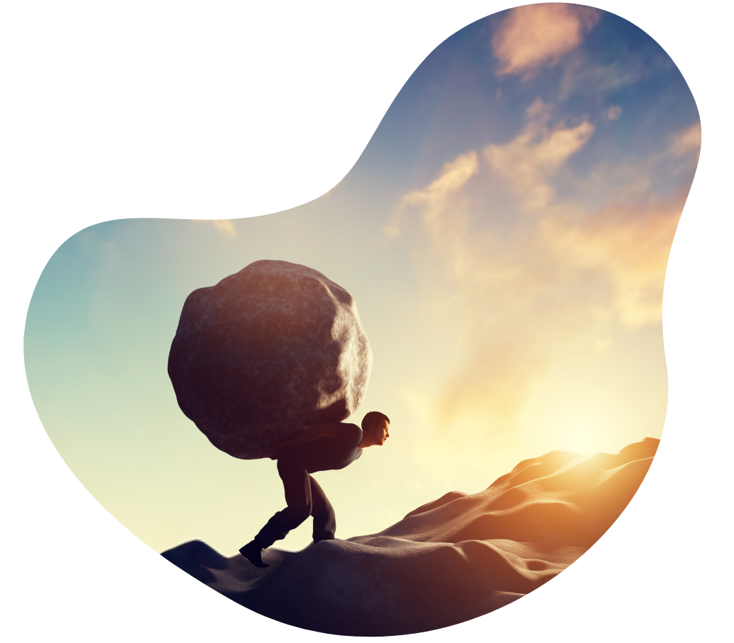 A man carrying a large boulder up a hill